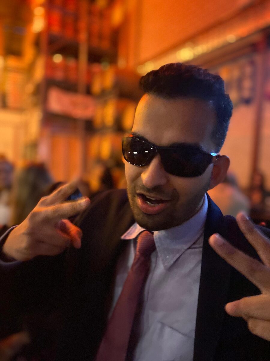 Close-up of Mayuresh in sunglasses throwing peace signs